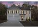 Charming two-story home with a two-car garage and beautifully manicured front yard at 382 Daffodil Dr, Temple, GA 30179