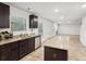 Modern kitchen features granite countertops, stainless steel appliances and an island with dark cabinets at 382 Daffodil Dr, Temple, GA 30179