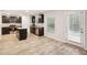 Modern kitchen featuring dark cabinets, stainless steel appliances, granite countertops and an island with breakfast bar at 382 Daffodil Dr, Temple, GA 30179