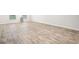 Large open living space showcasing hardwood flooring, recessed lighting, and neutral paint, perfect for entertaining at 382 Daffodil Dr, Temple, GA 30179