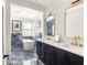 Bathroom featuring double sink vanity, freestanding tub with gold fixtures, and custom blue marble tile at 11572 Serenbe Ln, Chattahoochee Hills, GA 30268