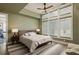 Bedroom featuring minimalist decor, neutral color palette, multiple windows, and carpet at 11572 Serenbe Ln, Chattahoochee Hills, GA 30268