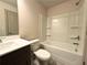 Bathroom with a toilet, vanity and shower-tub combo at 121 Honey Creek Rd, Conyers, GA 30094