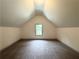 Bedroom featuring carpet, window and vaulted ceiling at 121 Honey Creek Rd, Conyers, GA 30094