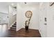 Welcoming foyer with hardwood floors, staircase, and elegant decor, leading into the home at 201 Cranapple Ln, Mcdonough, GA 30253