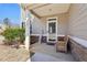 Inviting front porch with a welcome sign, wooden bench, and a well-maintained yard at 201 Cranapple Ln, Mcdonough, GA 30253