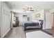 Spacious main bedroom featuring a ceiling fan, wood floors, and large windows providing natural light at 201 Cranapple Ln, Mcdonough, GA 30253