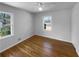 Bedroom with hardwood floors, natural light, and a ceiling fan at 233 Bay Creek Rd, Loganville, GA 30052