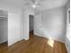 Cozy bedroom featuring hardwood floors, closet, and an entrance to another room at 233 Bay Creek Rd, Loganville, GA 30052