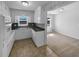 Bright kitchen featuring white cabinets, laminate countertops, and a stainless steel sink at 233 Bay Creek Rd, Loganville, GA 30052