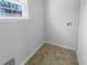 Laundry room with a window and washer/dryer hookups at 233 Bay Creek Rd, Loganville, GA 30052