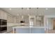 Elegant kitchen with white countertops, gray cabinets, and stylish pendant lighting at 400 Hatcher Ct, Hampton, GA 30228