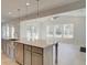 Kitchen island with stainless steel sink and faucet, gray cabinets, and modern countertops at 400 Hatcher Ct, Hampton, GA 30228