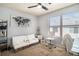 Bedroom featuring soft white futon sofa, neutral walls, and bright window at 5303 Fairington Club Dr # 5303, Lithonia, GA 30038