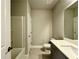 Well-lit bathroom featuring a shower-tub combo and modern vanity with a sink at 123 Honey Creek Rd, Conyers, GA 30094