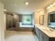 Bright bathroom featuring a tiled shower, garden tub, double vanity and tile floors at 123 Honey Creek Rd, Conyers, GA 30094