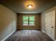 Bedroom featuring carpeted floors and a double-paned window that brings in plenty of natural light at 123 Honey Creek Rd, Conyers, GA 30094