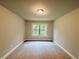 Carpeted bedroom with overhead light and window at 123 Honey Creek Rd, Conyers, GA 30094