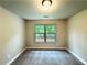 Carpeted bedroom with overhead light and window at 123 Honey Creek Rd, Conyers, GA 30094