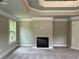 Bedroom featuring carpeted floors, an electric fireplace and double-paned windows at 123 Honey Creek Rd, Conyers, GA 30094