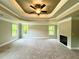 Large bedroom featuring a decorative ceiling, fireplace and many windows at 123 Honey Creek Rd, Conyers, GA 30094