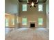 Expansive living room with a fireplace, abundant natural light, and plush carpeting at 123 Honey Creek Rd, Conyers, GA 30094