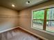 Walk-in closet featuring wire shelving and a window overlooking the greenery outside at 123 Honey Creek Rd, Conyers, GA 30094