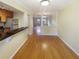 Open dining area with hardwood floors that flows into the kitchen at 165 N River Dr # G, Atlanta, GA 30350