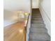 Hallway with carpeted stairs leading to the second floor at 165 N River Dr # G, Atlanta, GA 30350