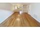 Open-concept living room featuring hardwood floors and view to dining area at 165 N River Dr # G, Atlanta, GA 30350