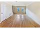 Bright living room featuring gleaming hardwood floors and neutral paint at 165 N River Dr # G, Atlanta, GA 30350