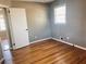 Bedroom featuring hardwood floors, bright window, and neutral wall color at 2179 Powers Ferry Dr, Marietta, GA 30067