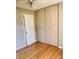 Cozy bedroom featuring hardwood floors, closet space, and natural light at 2179 Powers Ferry Dr, Marietta, GA 30067