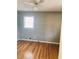 Bedroom with hardwood floors, a bright window, and neutral wall color at 2179 Powers Ferry Dr, Marietta, GA 30067