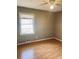 Bedroom with hardwood floors, window, and ceiling fan at 2179 Powers Ferry Dr, Marietta, GA 30067