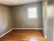 Bedroom features hardwood floors, bright window, and ample space at 2179 Powers Ferry Dr, Marietta, GA 30067