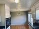 Cozy kitchen with ample cabinet space, view of dining area and neutral paint at 2179 Powers Ferry Dr, Marietta, GA 30067