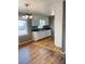 Functional kitchen area with classic white cabinets, and view of a dining space with natural light at 2179 Powers Ferry Dr, Marietta, GA 30067