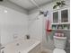 Clean, bright bathroom showing a bathtub and tile wall at 2700 Pine Tree Ne Rd # 1211, Atlanta, GA 30324