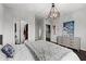 Bright bedroom featuring an elegant chandelier and an expansive closet at 2700 Pine Tree Ne Rd # 1211, Atlanta, GA 30324