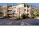 Apartment building featuring brick and siding with balconies and professional landscaping at 2700 Pine Tree Ne Rd # 1211, Atlanta, GA 30324