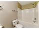 A bathroom featuring a bathtub, toilet, and towel rack at 5338 Creekview Ln, Morrow, GA 30260