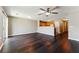 Spacious living room featuring hardwood floors, ceiling fan, and sliding doors at 5338 Creekview Ln, Morrow, GA 30260