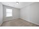 Inviting bedroom with neutral tones and a window, offering a cozy and private retreat at 2308 Oakton Se Pl, Smyrna, GA 30082