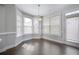 Sunlit dining area with large windows and hardwood floors at 2308 Oakton Se Pl, Smyrna, GA 30082