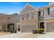 Inviting townhome with neutral colors, a brick facade, and manicured landscaping at 2308 Oakton Se Pl, Smyrna, GA 30082