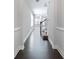 Elegant hallway with hardwood floors leading to a staircase at 2308 Oakton Se Pl, Smyrna, GA 30082