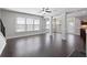 Bright living room featuring hardwood floors, large windows, and elegant white columns at 2308 Oakton Se Pl, Smyrna, GA 30082