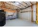 Unfinished basement featuring exposed ceiling, concrete walls, and a safe at 3070 Corsair Curv, Cumming, GA 30040