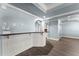 Basement bar area with granite countertops and sleek modern white paneling at 3070 Corsair Curv, Cumming, GA 30040